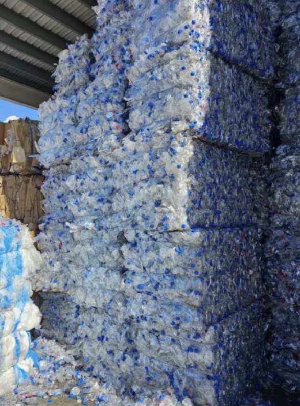 Bales of compressed post-consumer PET bottles